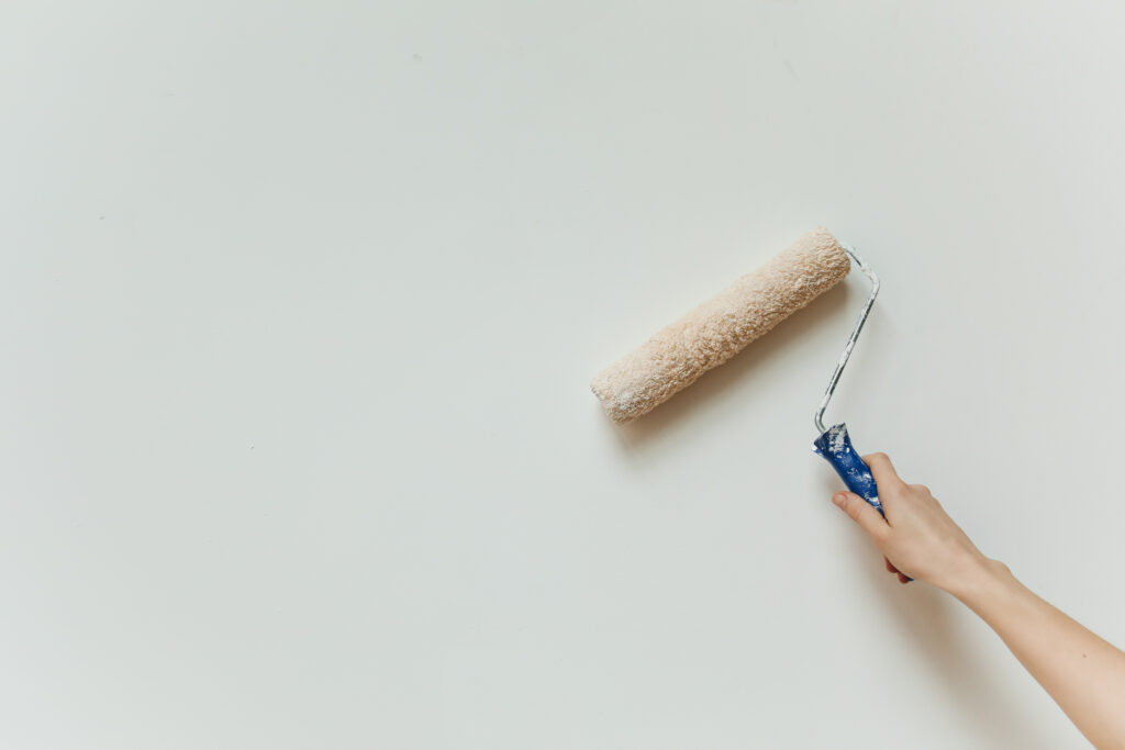 A person painting a wall