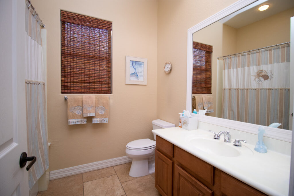 A white ceramic sink near the toilet bowl