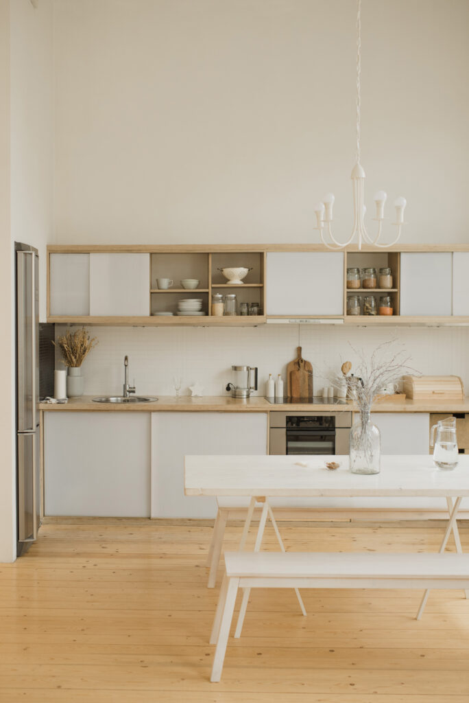 White dining table and chairs in a kitchen