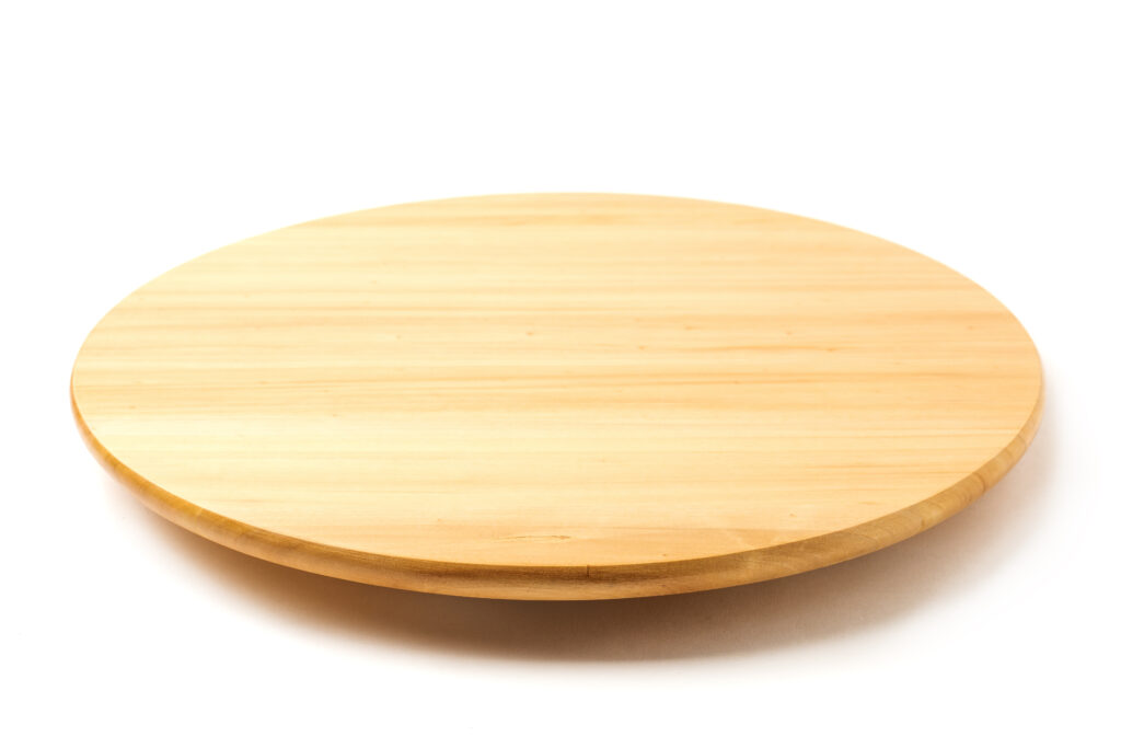 Bamboo or wooden rotating tray isolated on white background.