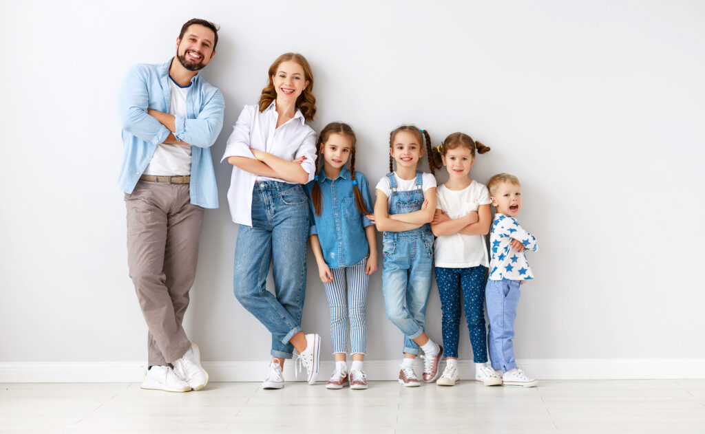 large family mother father and children sons and daughters on white background