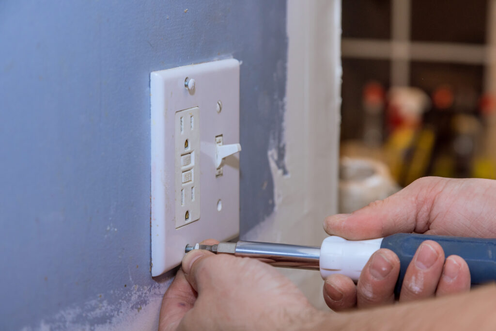 Removing wall switch cover in order to mask the outlet in preparation for painting