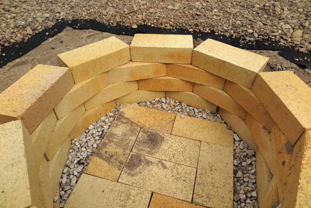 Step by step making of a fire pit using yellow aluminous bricks