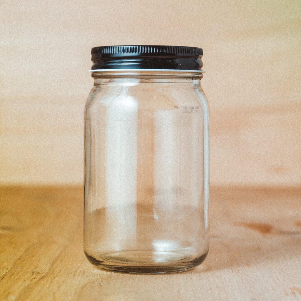 The simplicity of an empty jar with lid.