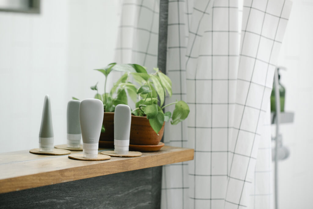 Tubes with skincare products in bathroom