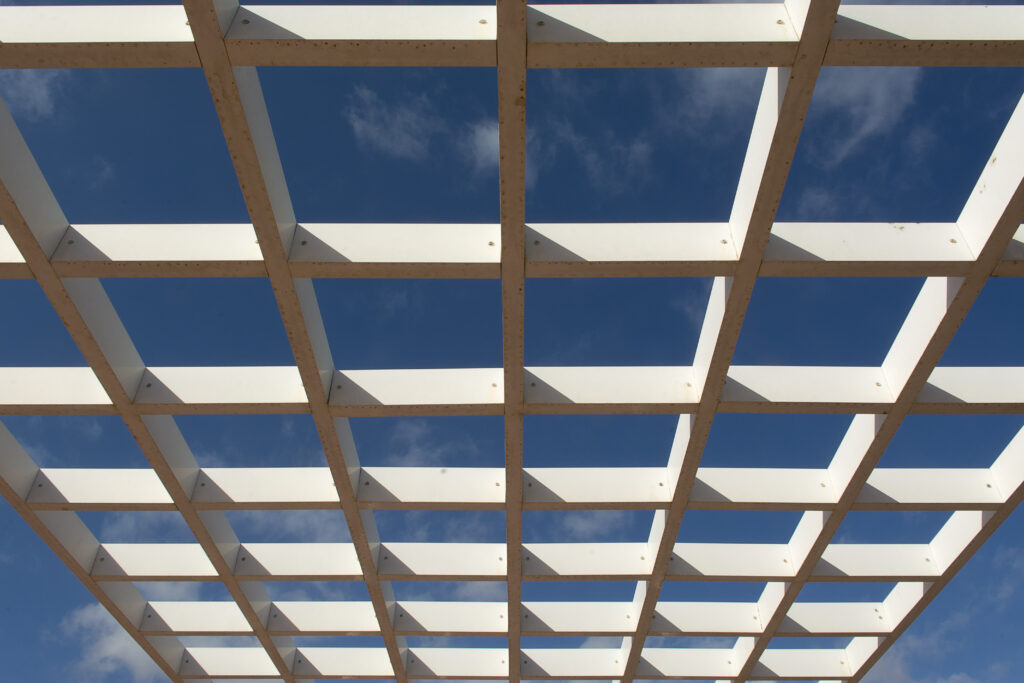 Wooden pergola ceiling with square pattern