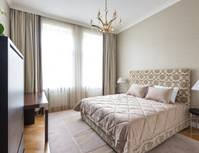 Bedroom interior with bedroom under chandelier