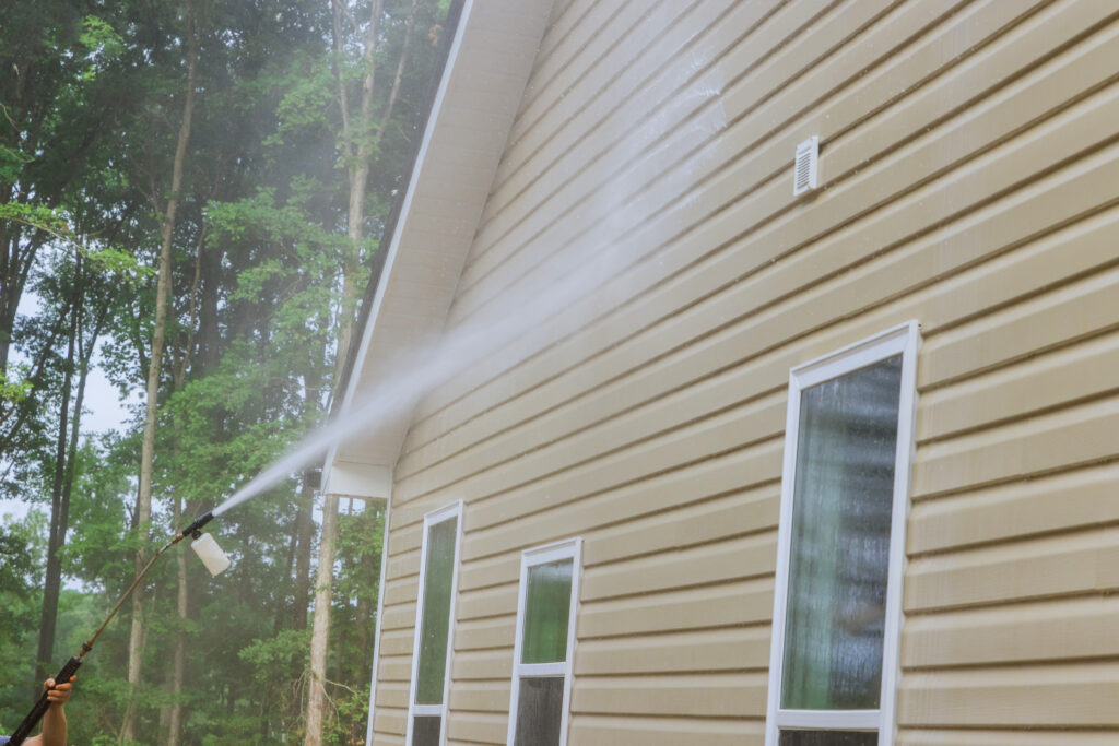 Cleaning maintenance service for washing siding house and maintaining the home a high-pressure spray nozzle with soap cleaner and water