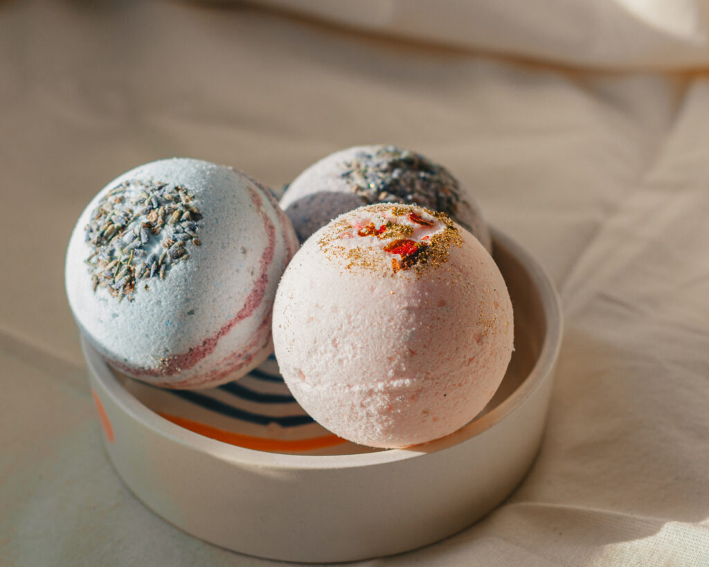 Collection of fragrant bath bombs in bowl