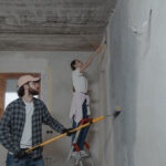 Couple painting the room