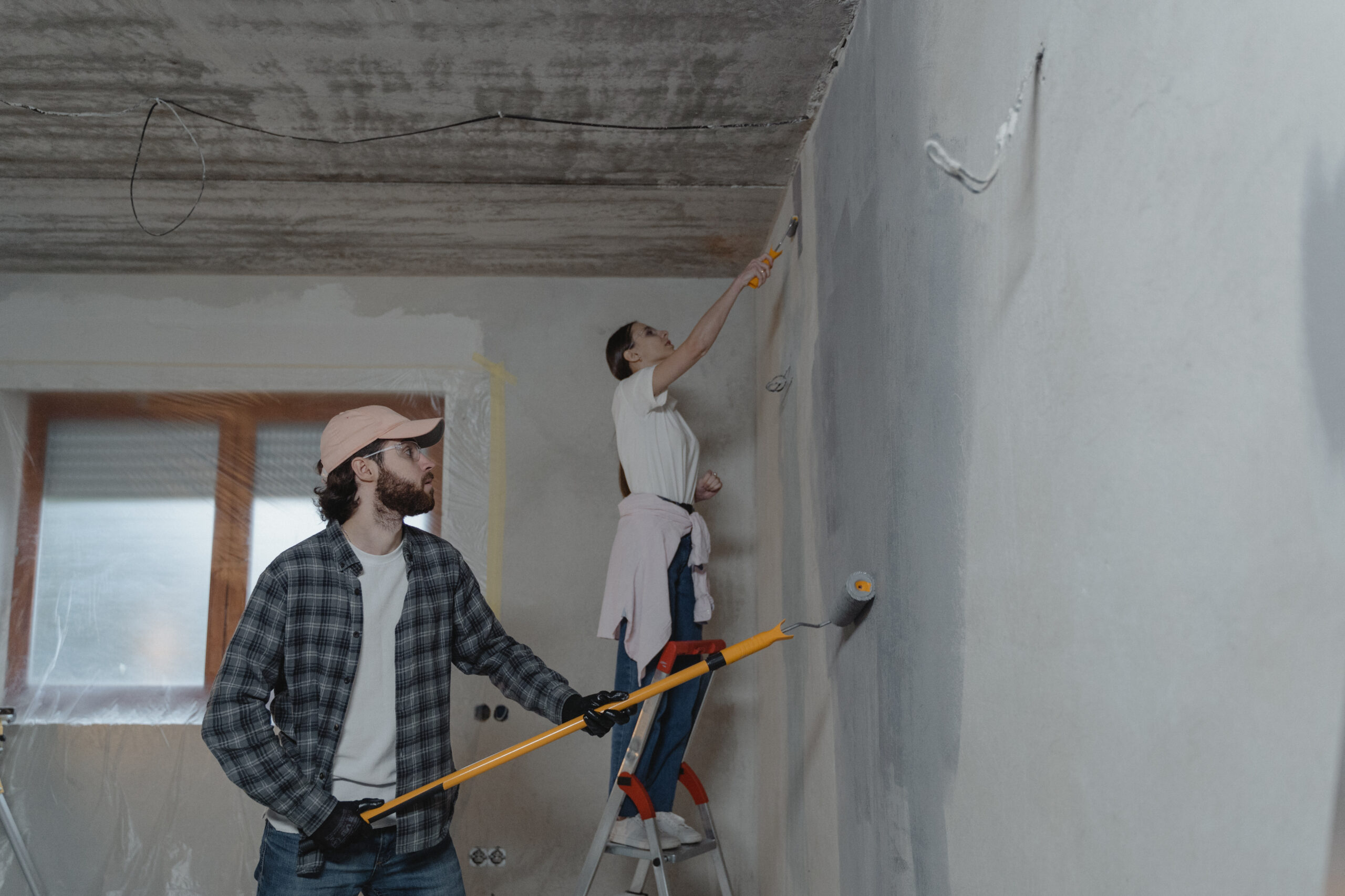 Couple painting the room