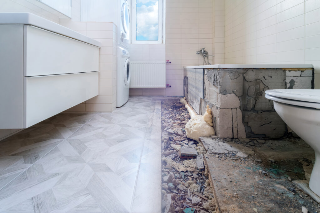 Bathroom renovation before and after. Laying new stone tiles in modern math room. Comparison view of floor reconstruction