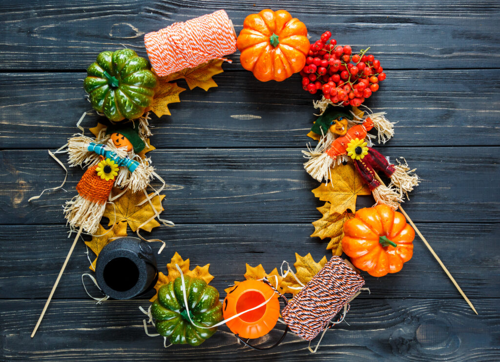 colorful wreath for Halloween decoration: made from rowan, pumpkins, leaves, lanterns. Halloween concept