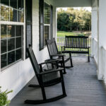 Front Porch of Southern home with Black Rocking Chairs and a Casual Feel