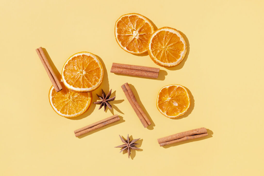 Overhead shot of orange slices and cinnamon sticks