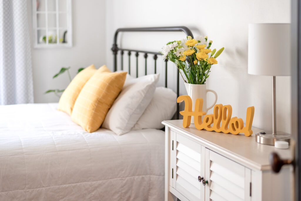 Cheerful hello sign in clean and bright bedroom