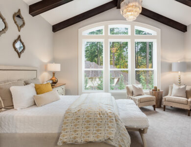 Bedroom with unique touches like mirrors, exposed beams and natural light