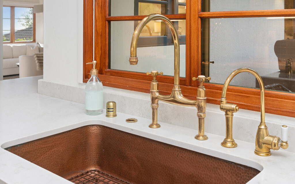 Copper sink and gold faucet