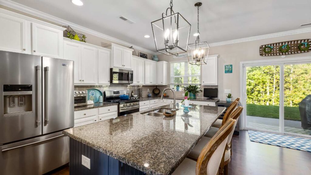 a kitchen with granite counter tops and stainless steel appliances