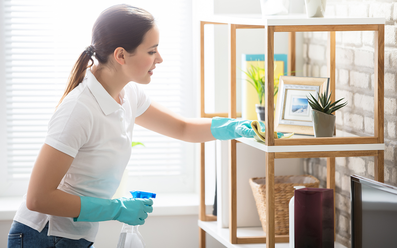 Woman cleaning her house