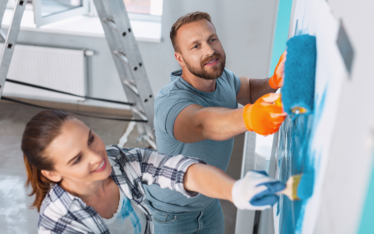 Couple working on refurbishing a house