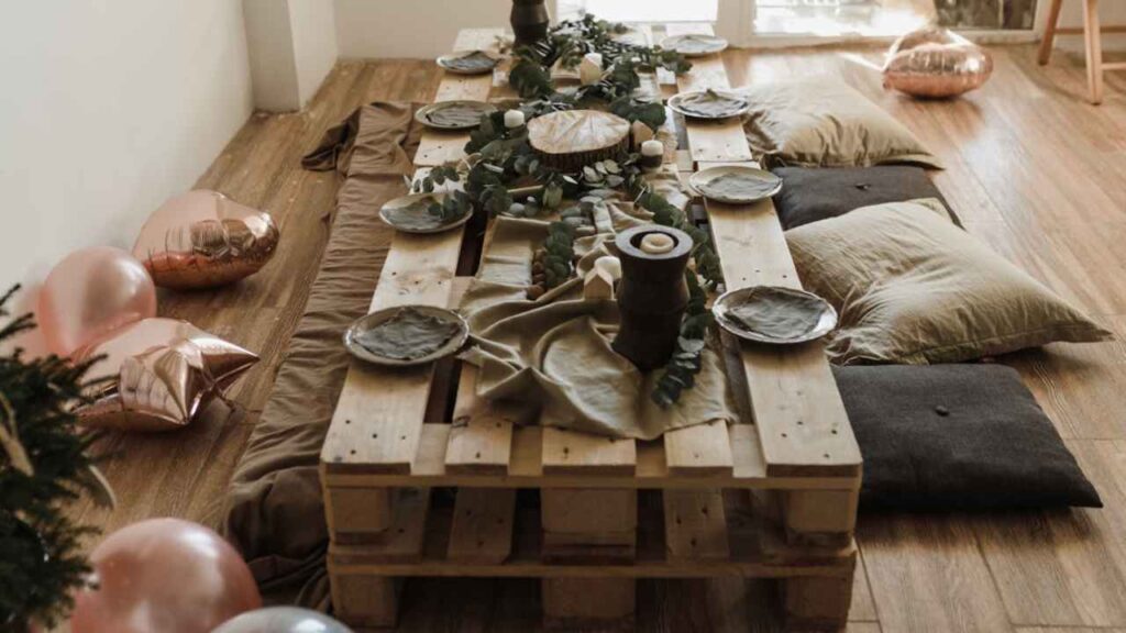 a wooden table is set up on a wooden floor