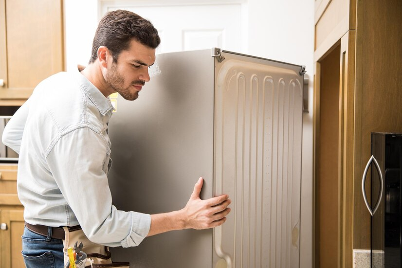 man moving his refrigerator 