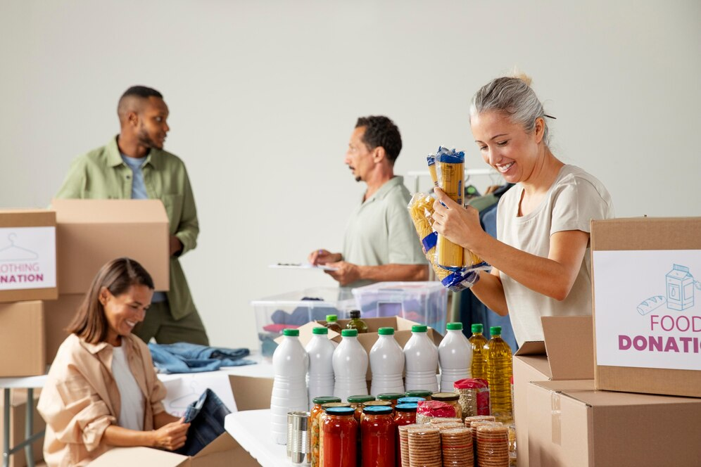 group of people packing food donations