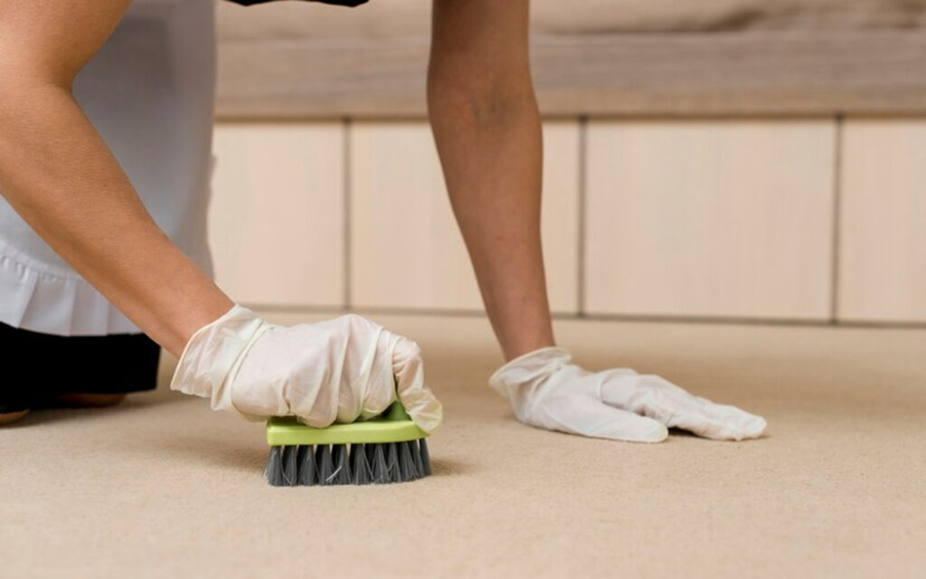 Cleaning floor with a scrub brush