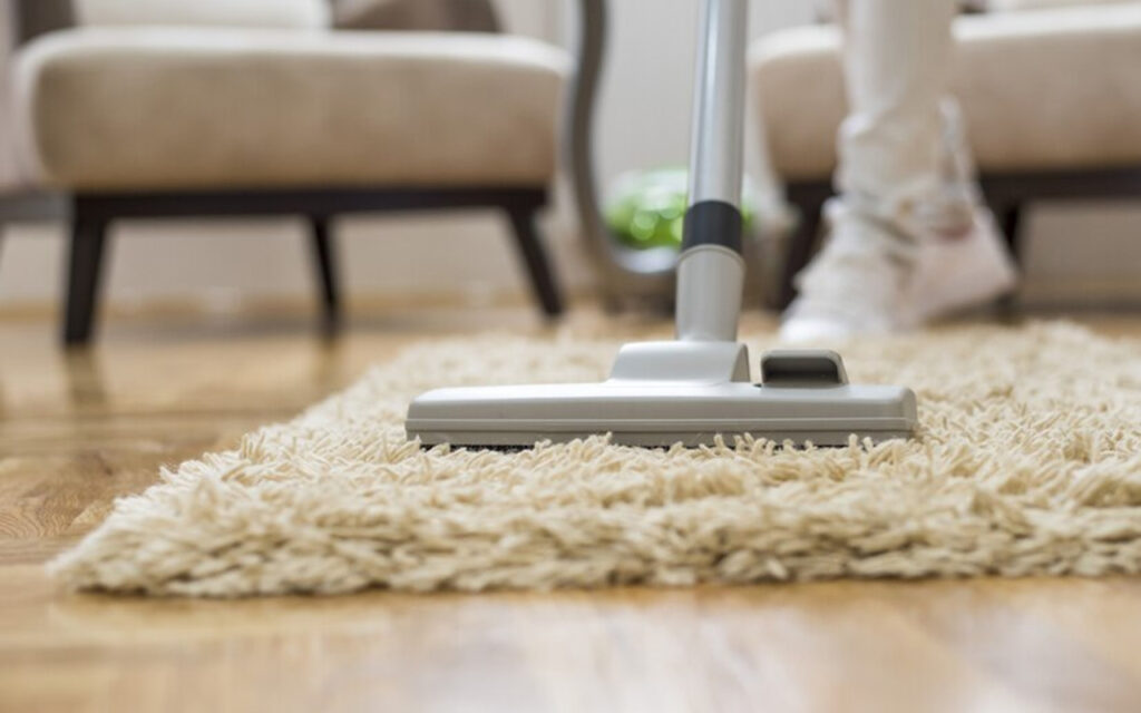 Vacuuming a shag rug