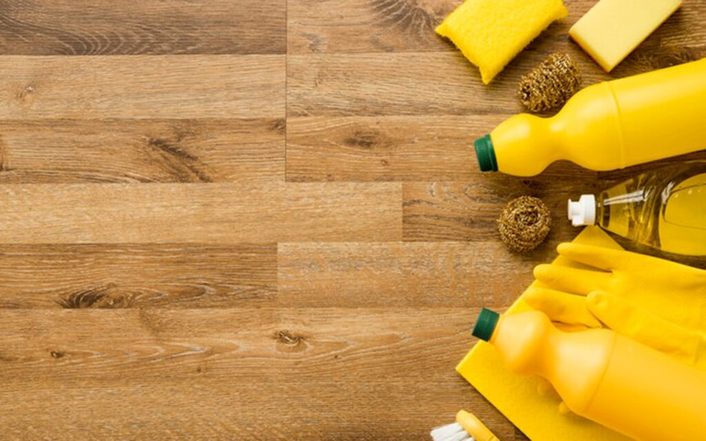 Cleaning supplies on a wooden floor