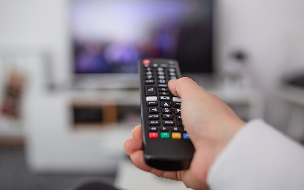 Person using a television remote