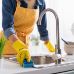 Woman cleaning a kitchen