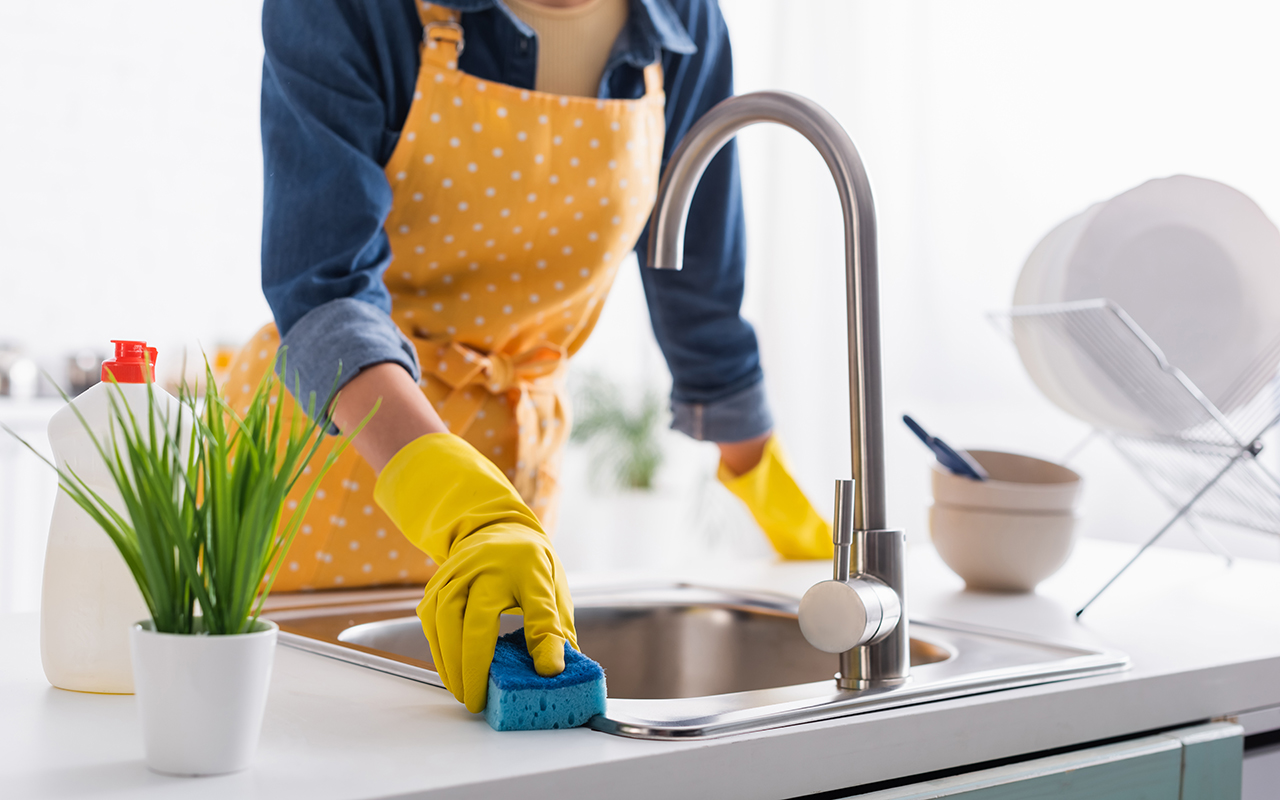 Woman cleaning a kitchen